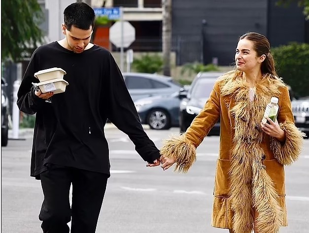 Addison Rae and beau Omer Fedi seem very much in love as they hold hands and hug while picking up lunch in LA